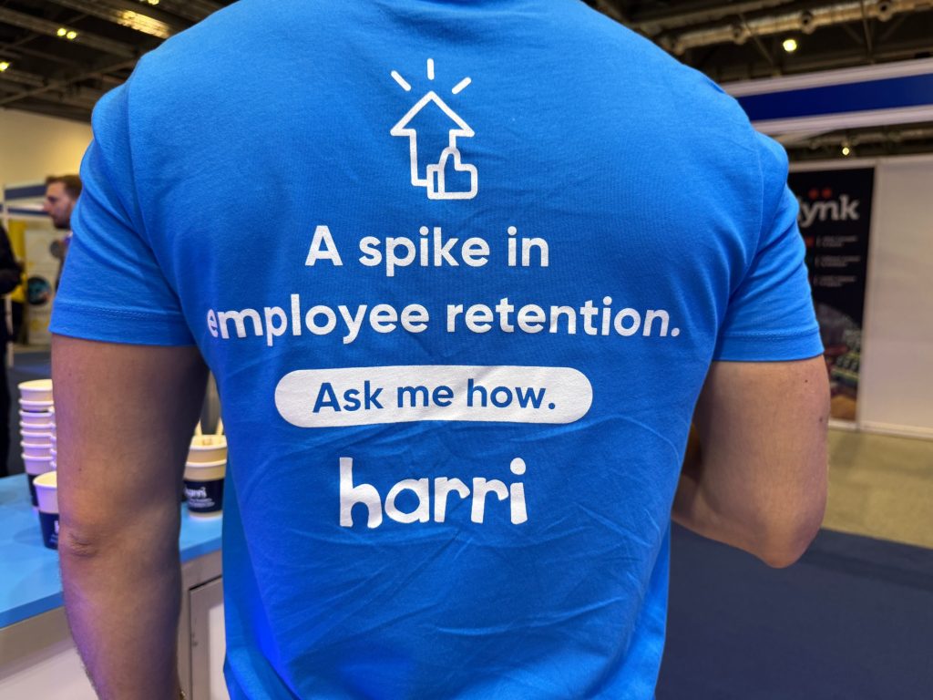 Blue T shirt that says: A spike in employee retention. Ask me how